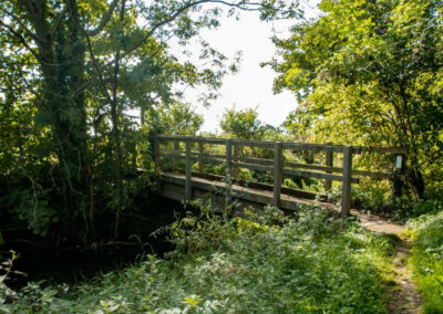 Walkbridge across the brook that grows into the Thames.