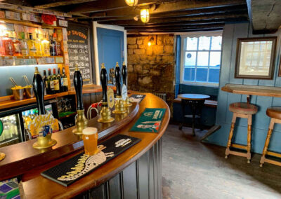 By the bar in the Turf Tavern in Oxford, renowned for featuring in the classic detective series Inspector Morse.